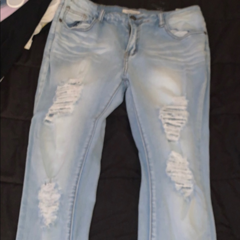 Light blue ripped jeans